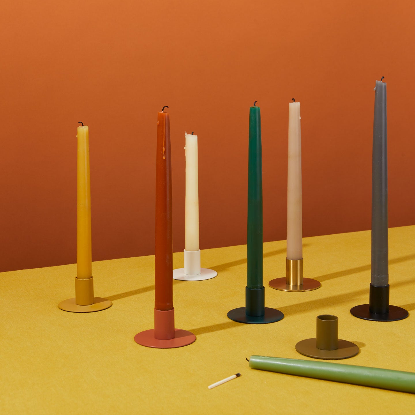 Hand dipped candles in candle holders