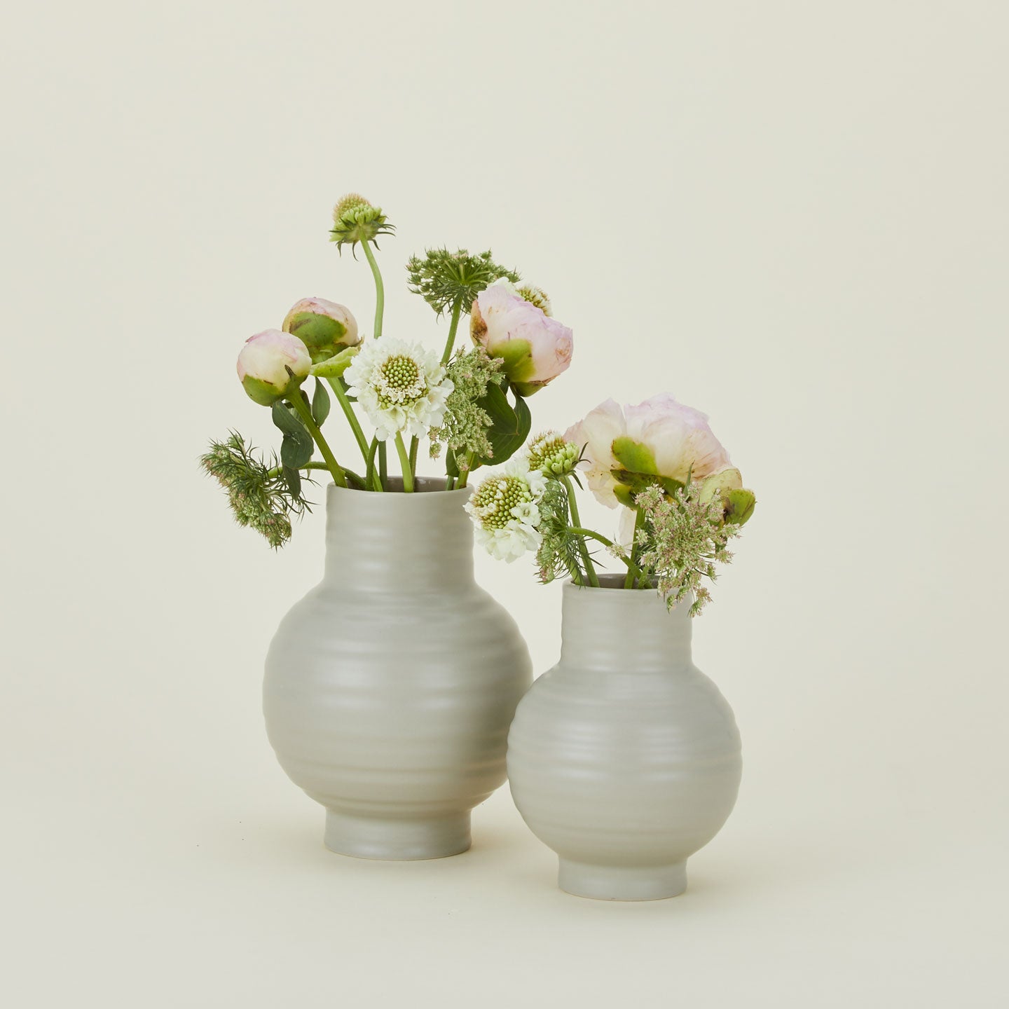 Essential Ceramic Vase in Light Grey in Small and Large sizes with flowers.
