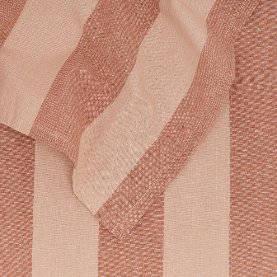 Close up of Essential Striped Tablecloth in Blush and Terracotta.