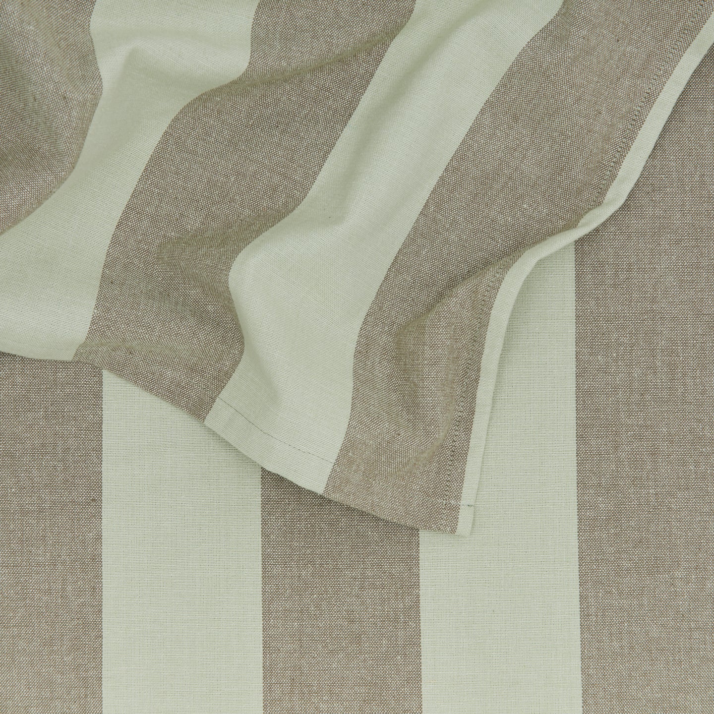 Close up of Essential Striped Tablecloth in Olive and Sage.