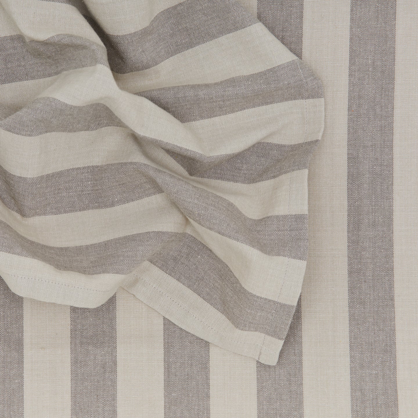Close up of Essential Striped Dinner Napkin in Light Grey and Dark Grey.