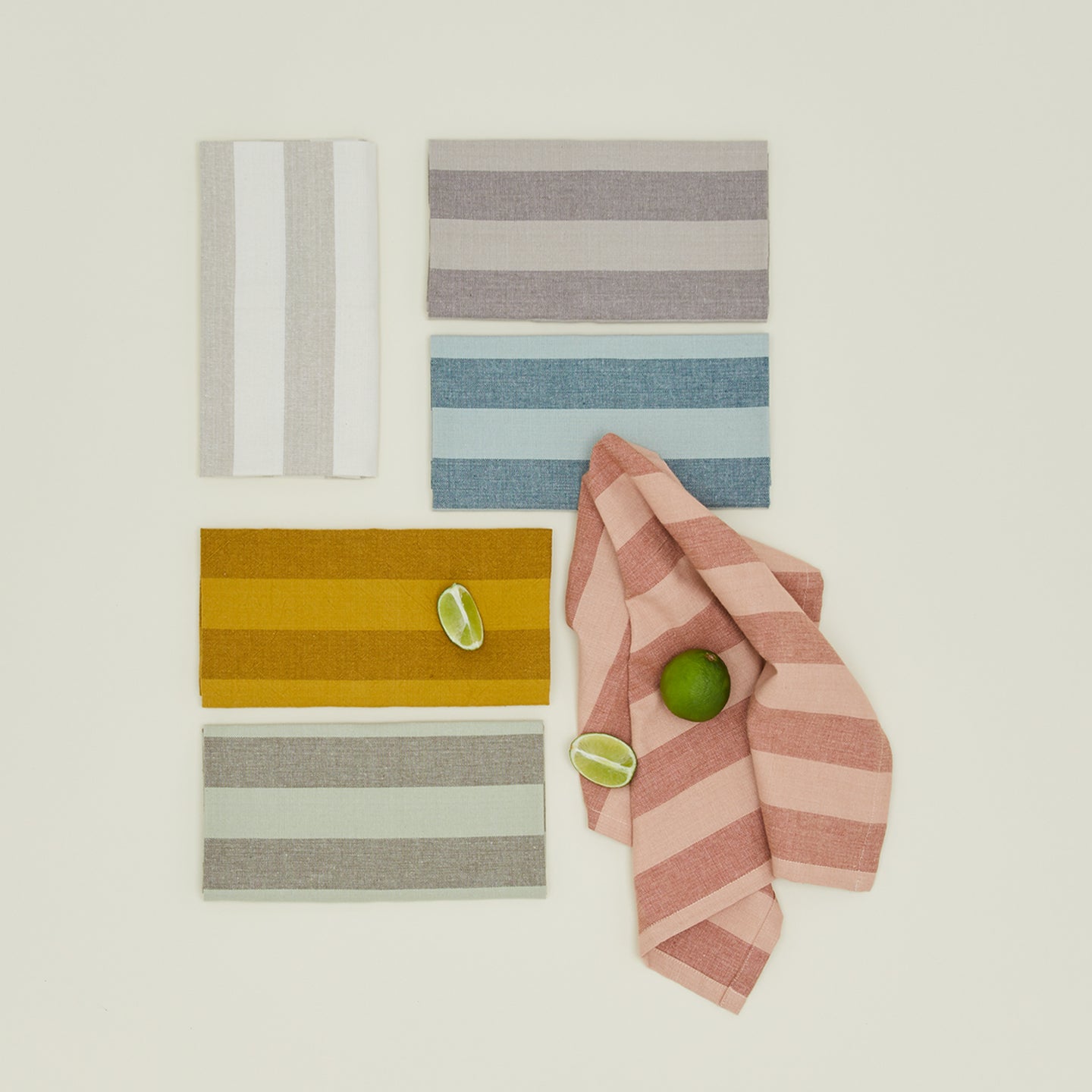 Group of Essential Striped Dinner Napkins in various colors.
