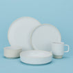 Group of Modernist Dinnerware including low bowl, cereal bowl, salad plate, dinner plate and mug.