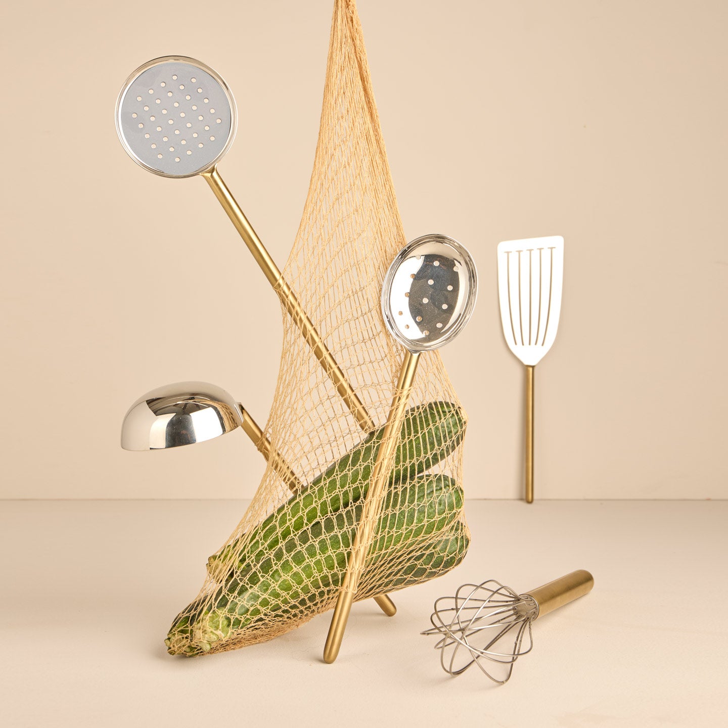 Simple metal kitchen utensils in brass