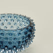 Close up of glass hobnail blue tapas bowl.