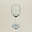 Three-quarter angle of ribbed blue wine glass.
