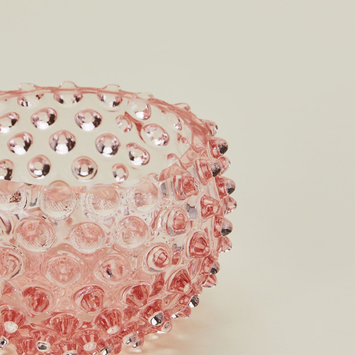 Close up of glass hobnail blush tapas bowl.