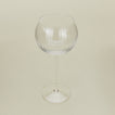 Three-quarter angle of ribbed clear wine glass.