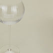 Close up of ribbed clear wine glass.