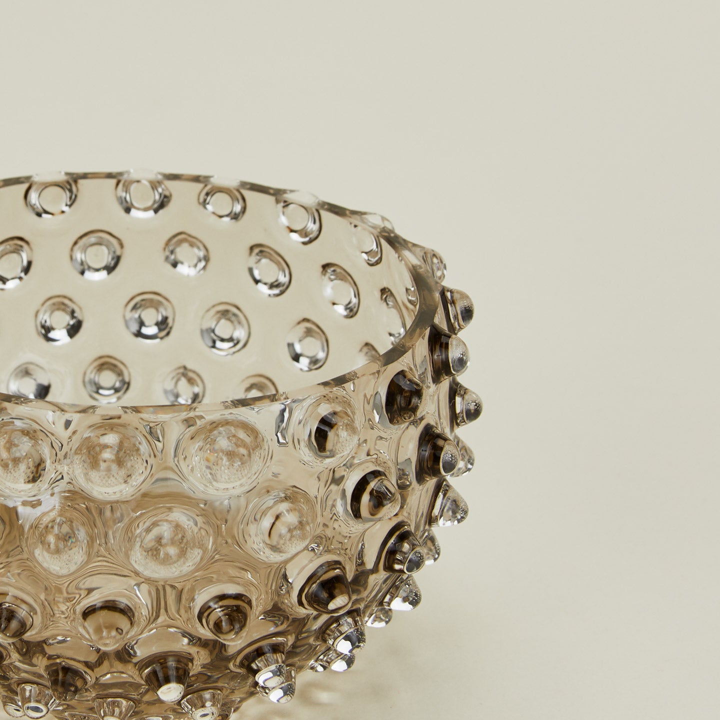 Close up of glass hobnail grey tapas bowl.