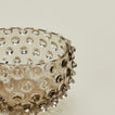 Close up of glass hobnail grey tapas bowl.