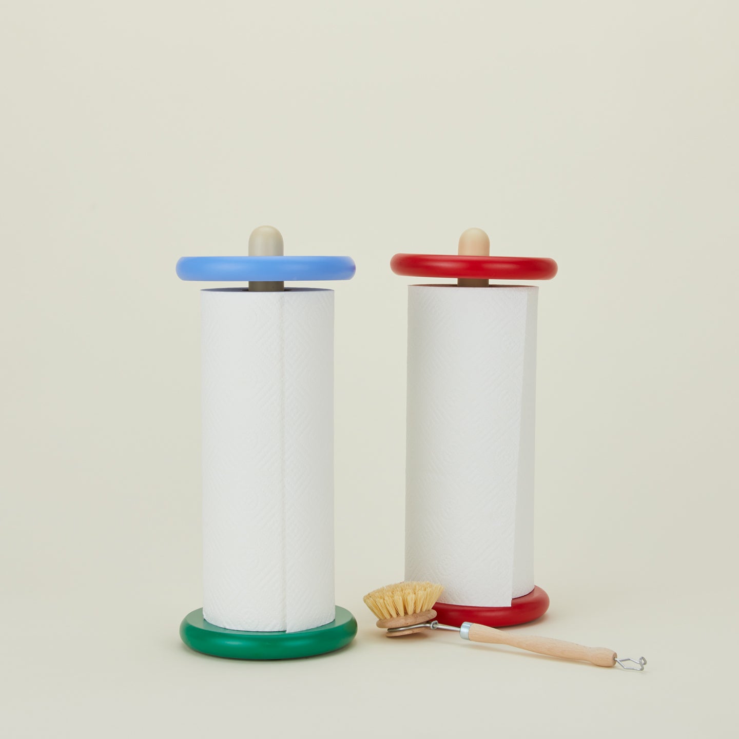 Spool paper towel holders in red and blue with scrub brush