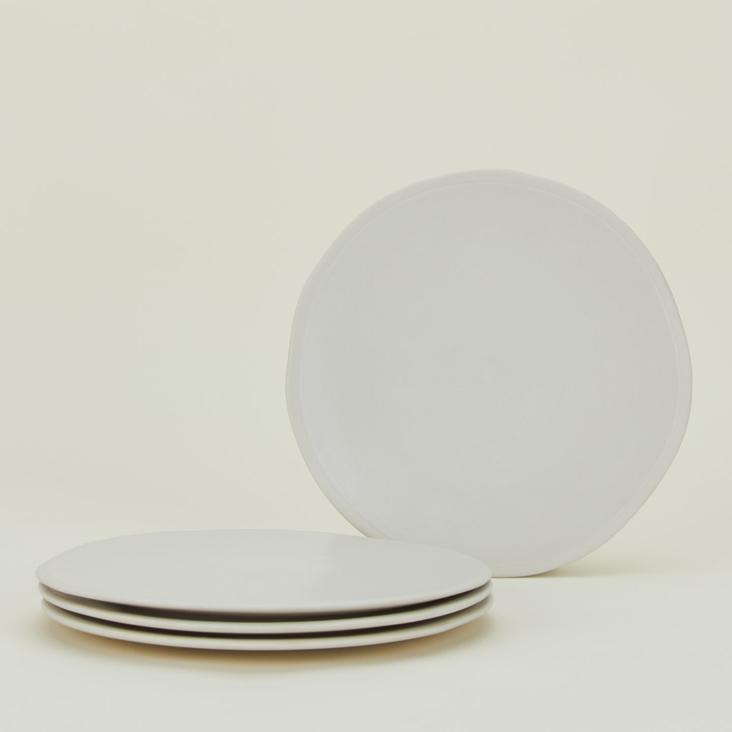 Group of four Atelier Dinner Plates.
