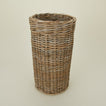 Close up view of rattan umbrella stand.