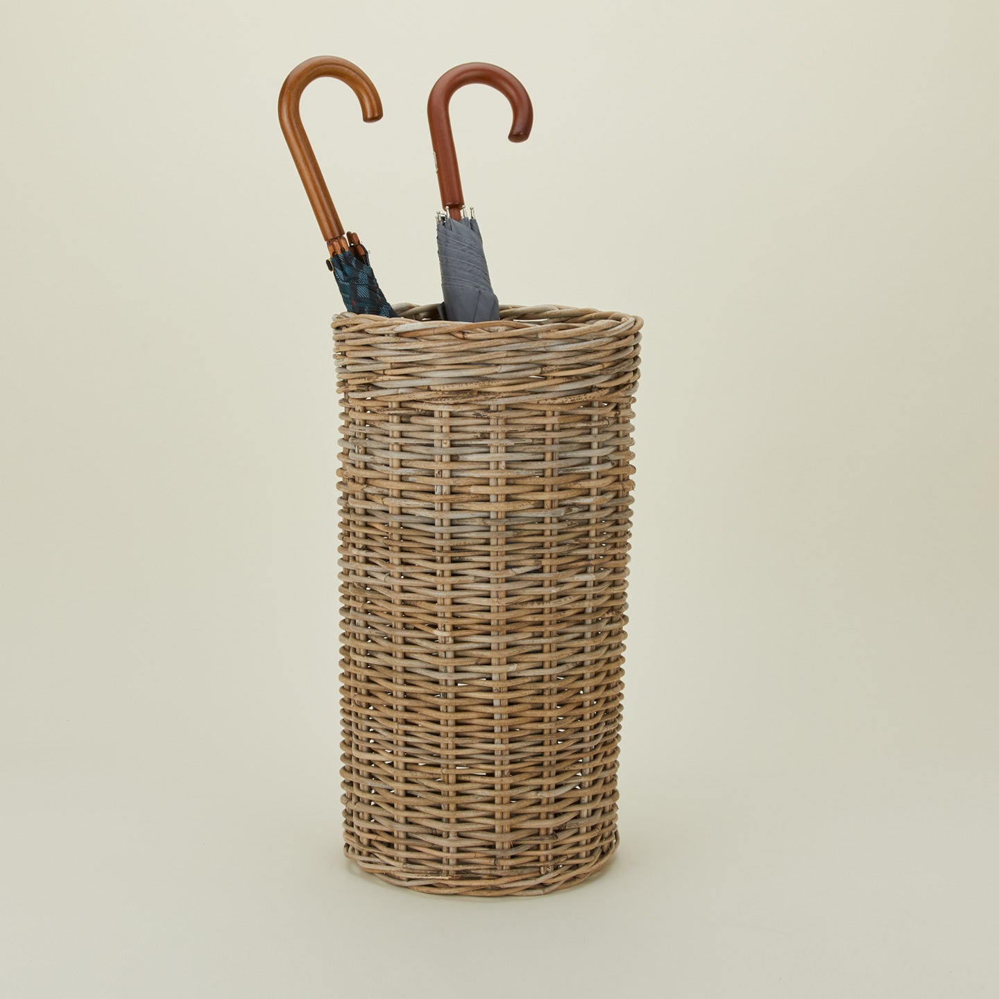 Rattan umbrella stand with umbrellas