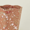 Detail of marbled scalloped wastebasket in mocha.