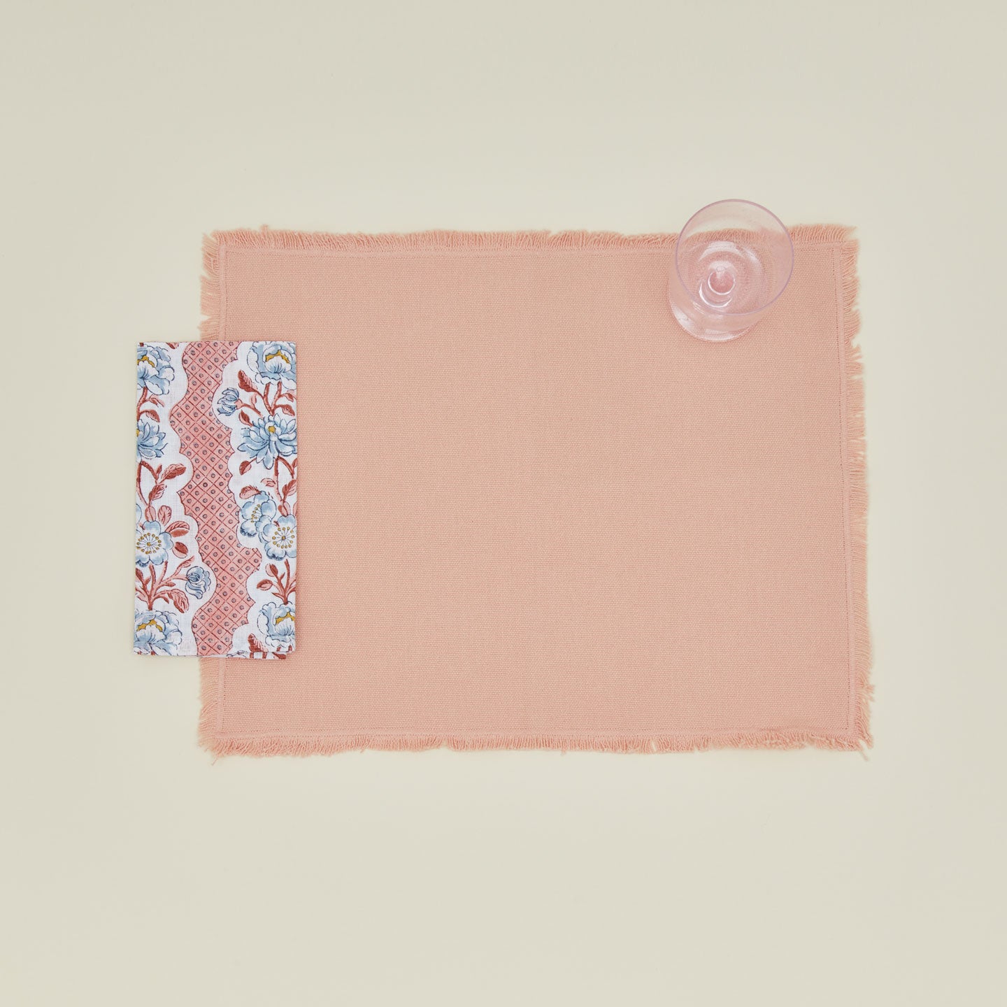 Place setting with block printed floral napkin in blush.