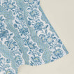 Detail of block printed napkin with a floral pattern in indigo.