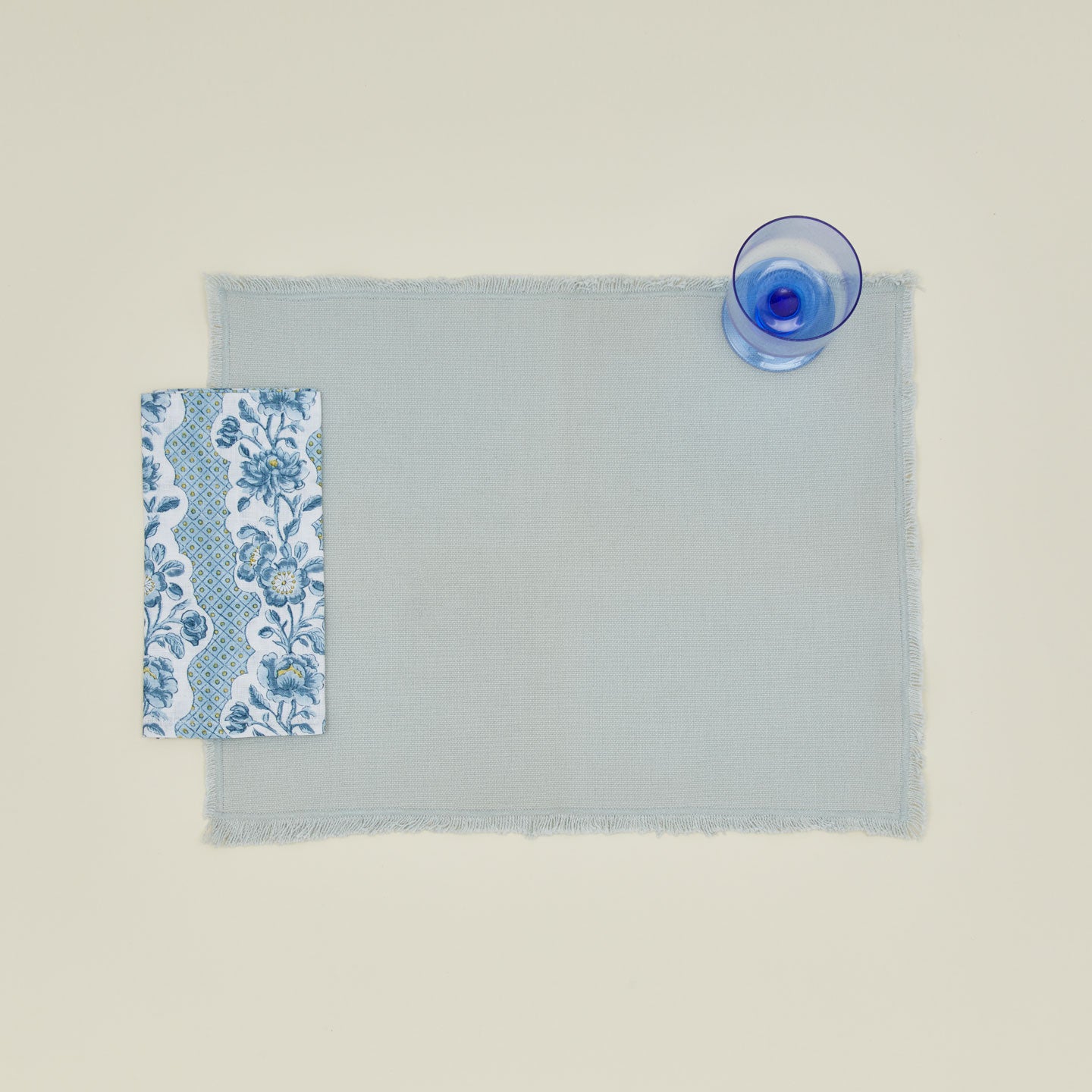 Place setting with block printed floral napkin in indigo.