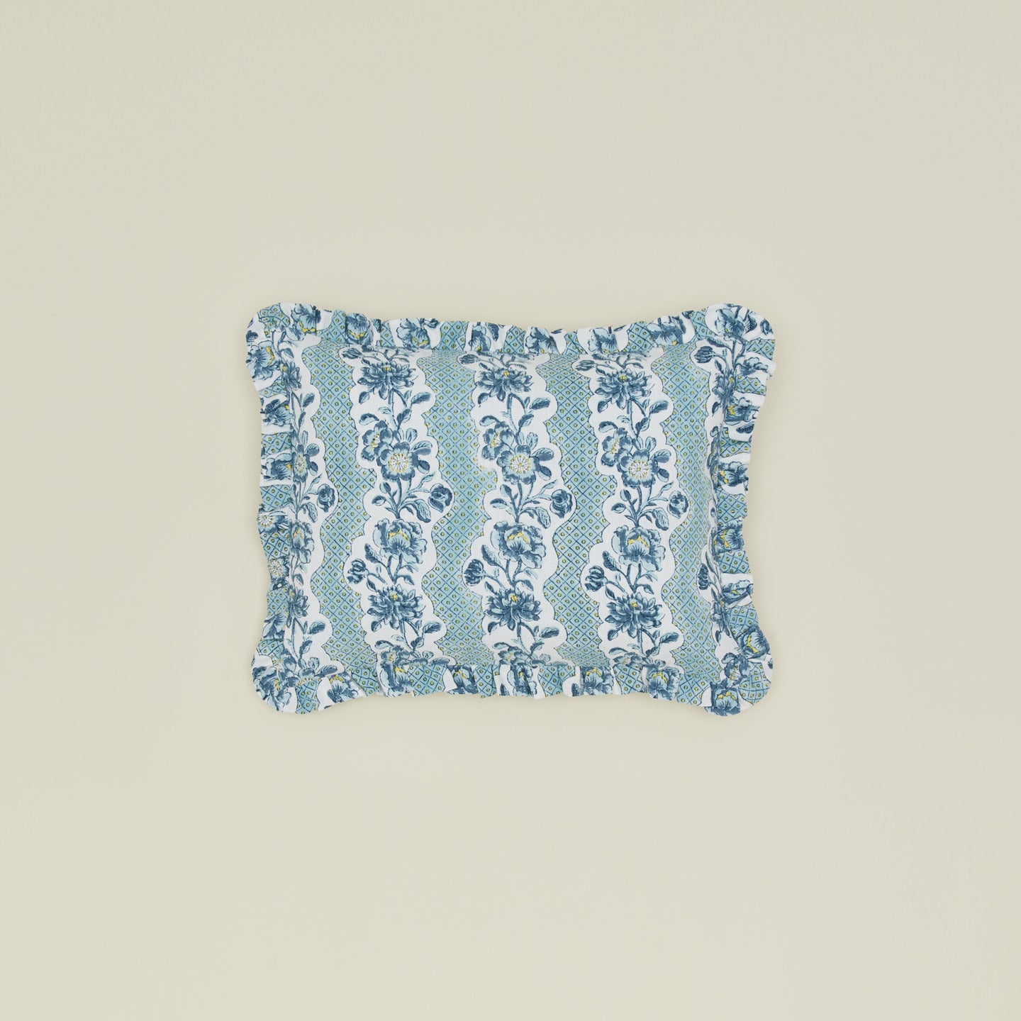 Block printed floral ruffled pillow in indigo.