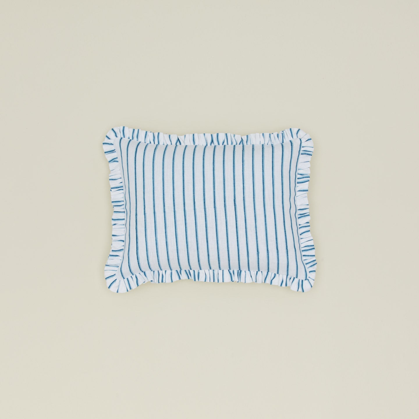 Block printed striped ruffled pillow in indigo.