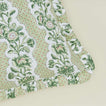 Detail of block printed floral ruffled pillow in olive.
