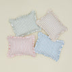 Striped block printed pillows in various colors.