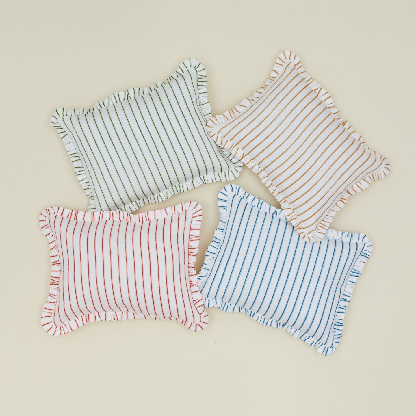 Striped block printed pillows in various colors.