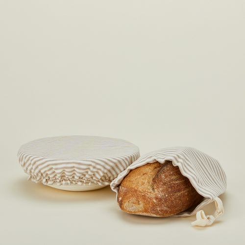 Dot and Army bread bag and bowl cover with loaf of bread.