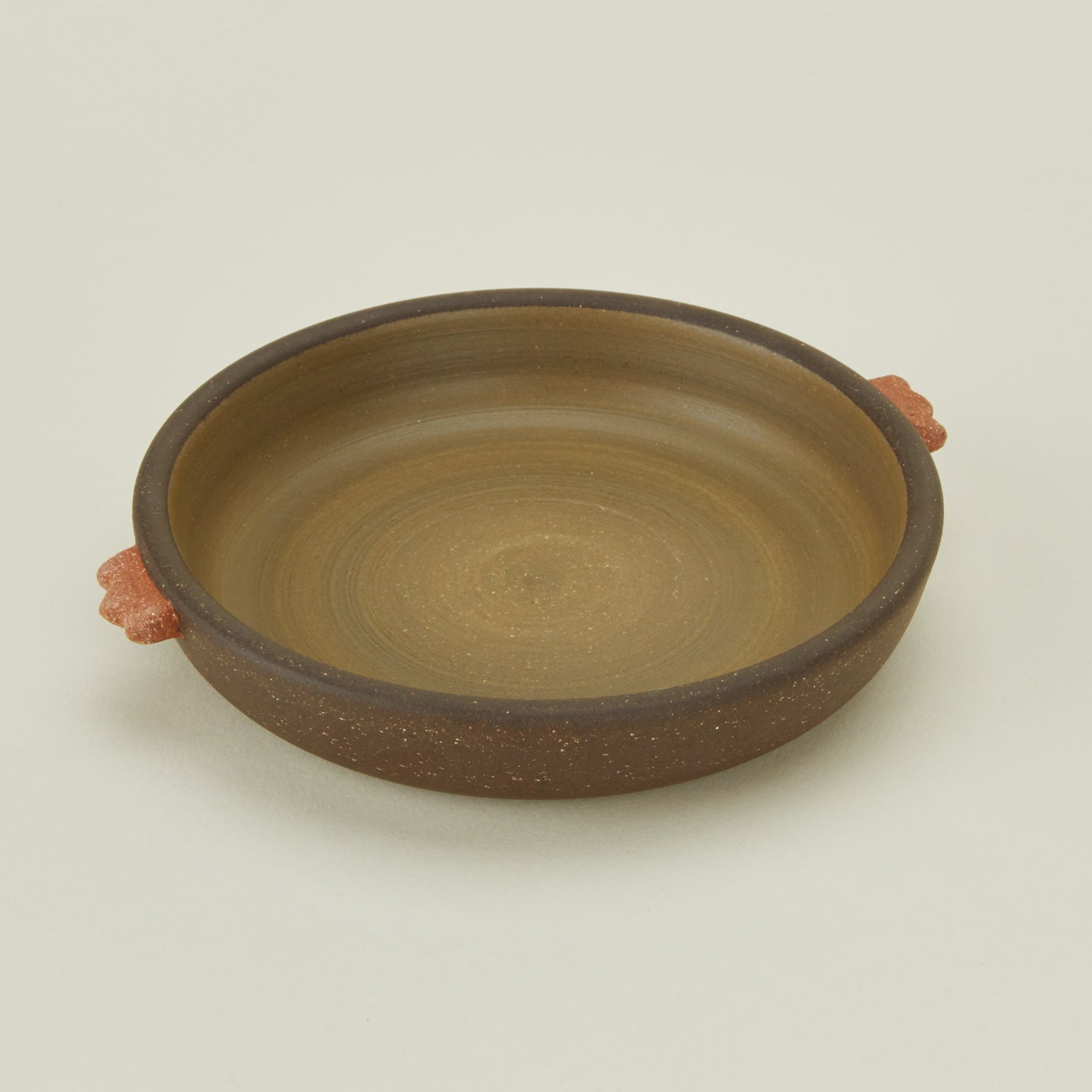 Detailed view of stoneware nub saucer