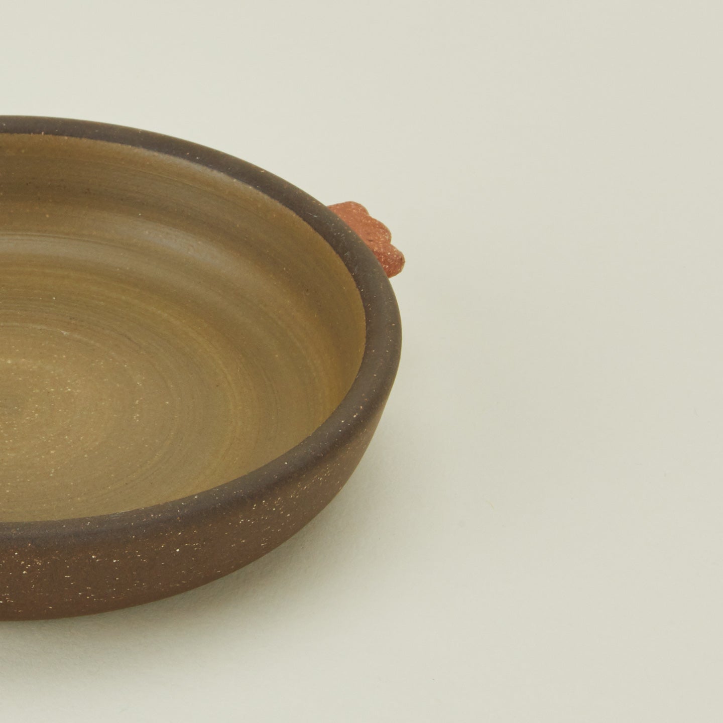 Close up view of stoneware nub saucer