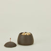 Stoneware squiggle jar with lid removed and filled with macadamia nuts