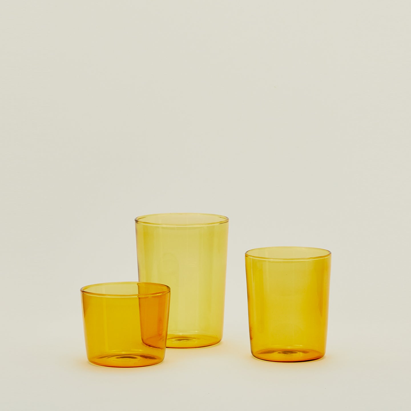 Group of three Essential Glasses in Amber in Small, Medium and Large sizes.