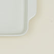 Close up view of 8" x 8" essential bakeware in bone