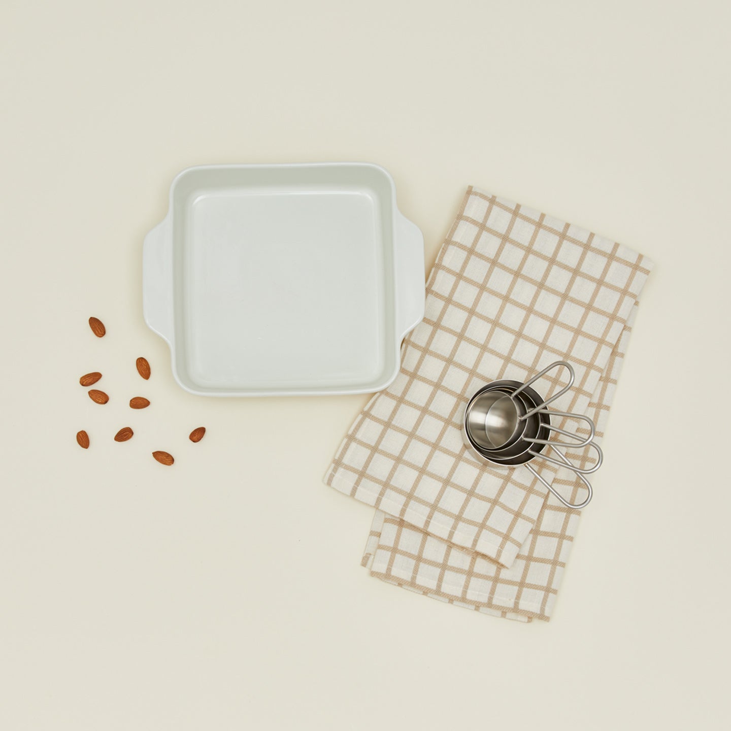 8x8 bakeware in bone with almonds dishtowel and measuring cups 