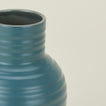 Close up view of essential ceramic vase in peacock
