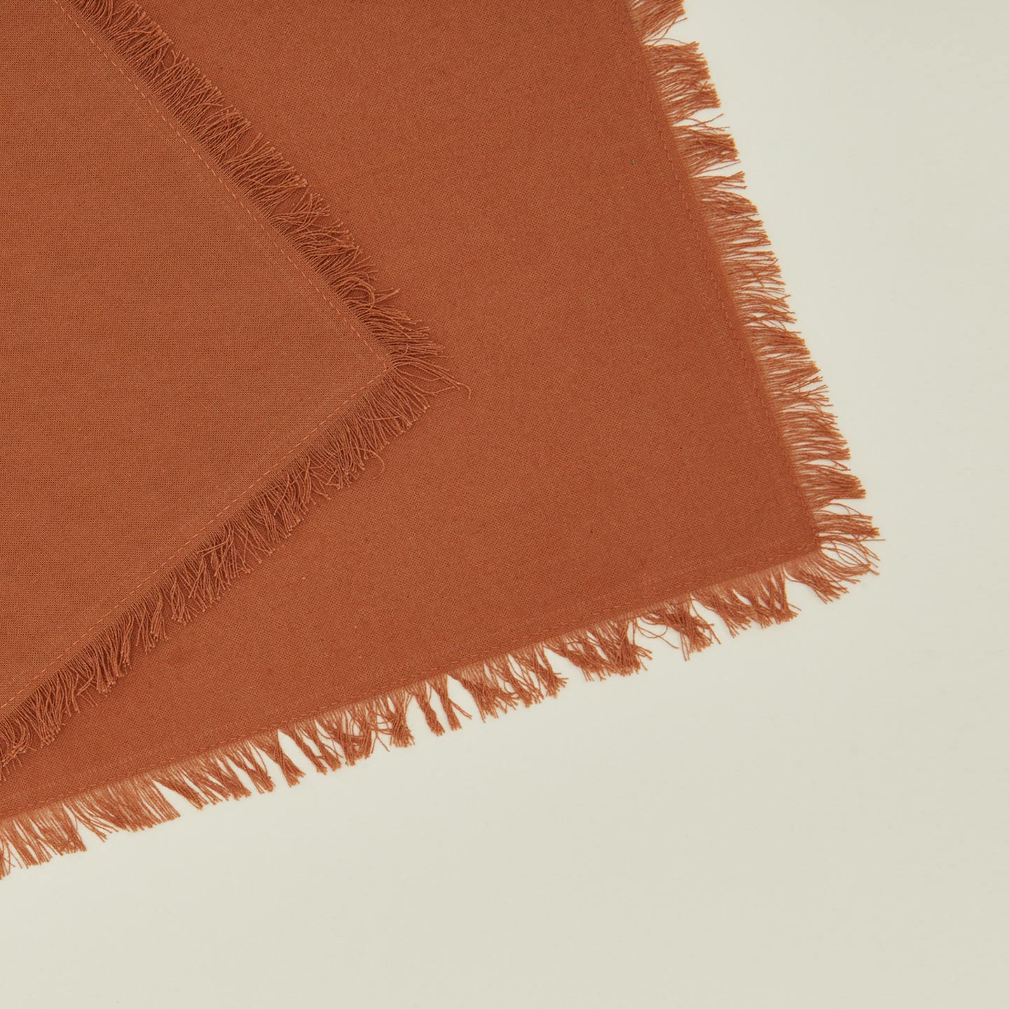 Close up view of essential cocktail napkin in terracotta