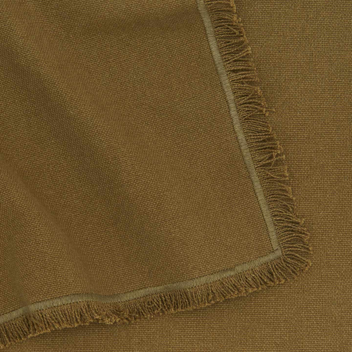 Close up view of essential cotton placemat in olive