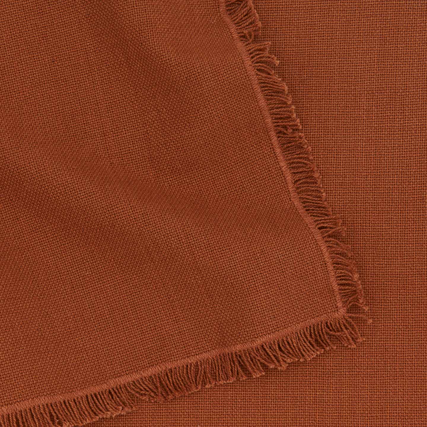 Close up view of essential cotton placemat in terracotta