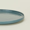 Close up view of essential dinner plate in peacock