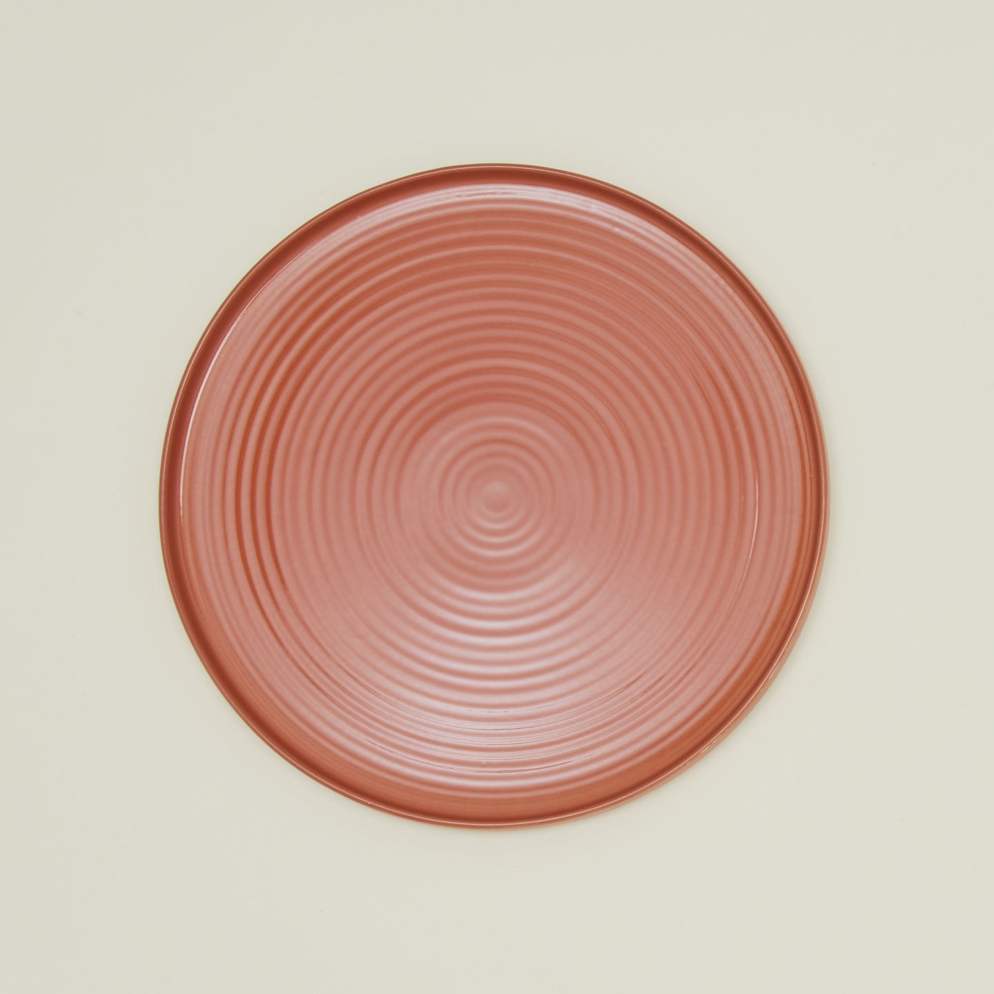 Overhead view of essential serving platter in terracotta
