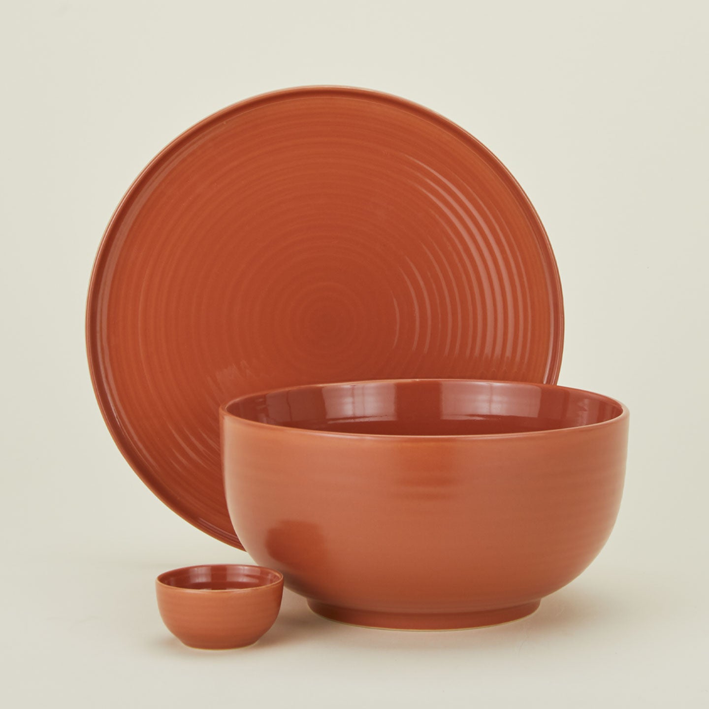 Essential serving set in terracotta with platter serving bowl and extra small bowl