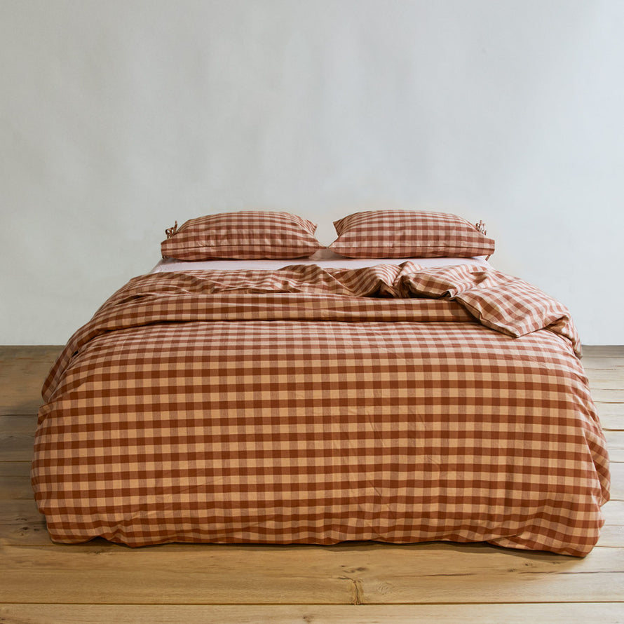 Essential Gingham Pillowcases, Set of 2 - Blush/Terracotta on bed with matching duvet cover