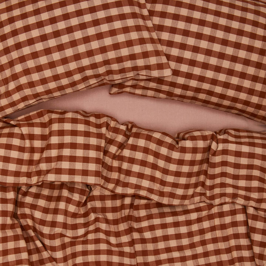 Essential Gingham Pillowcases, Set of 2 - Blush/Terracotta on bed with matching duvet