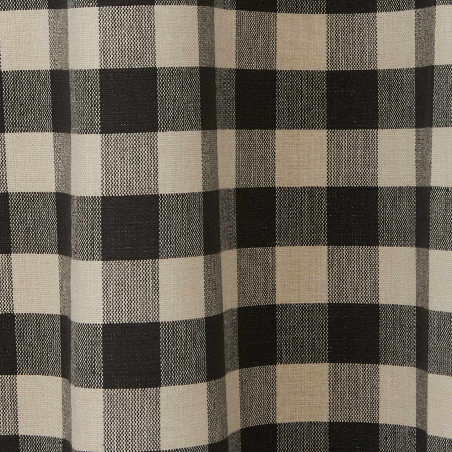 Close up view of grey and black gingham shower curtain