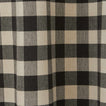 Close up view of grey and black gingham shower curtain