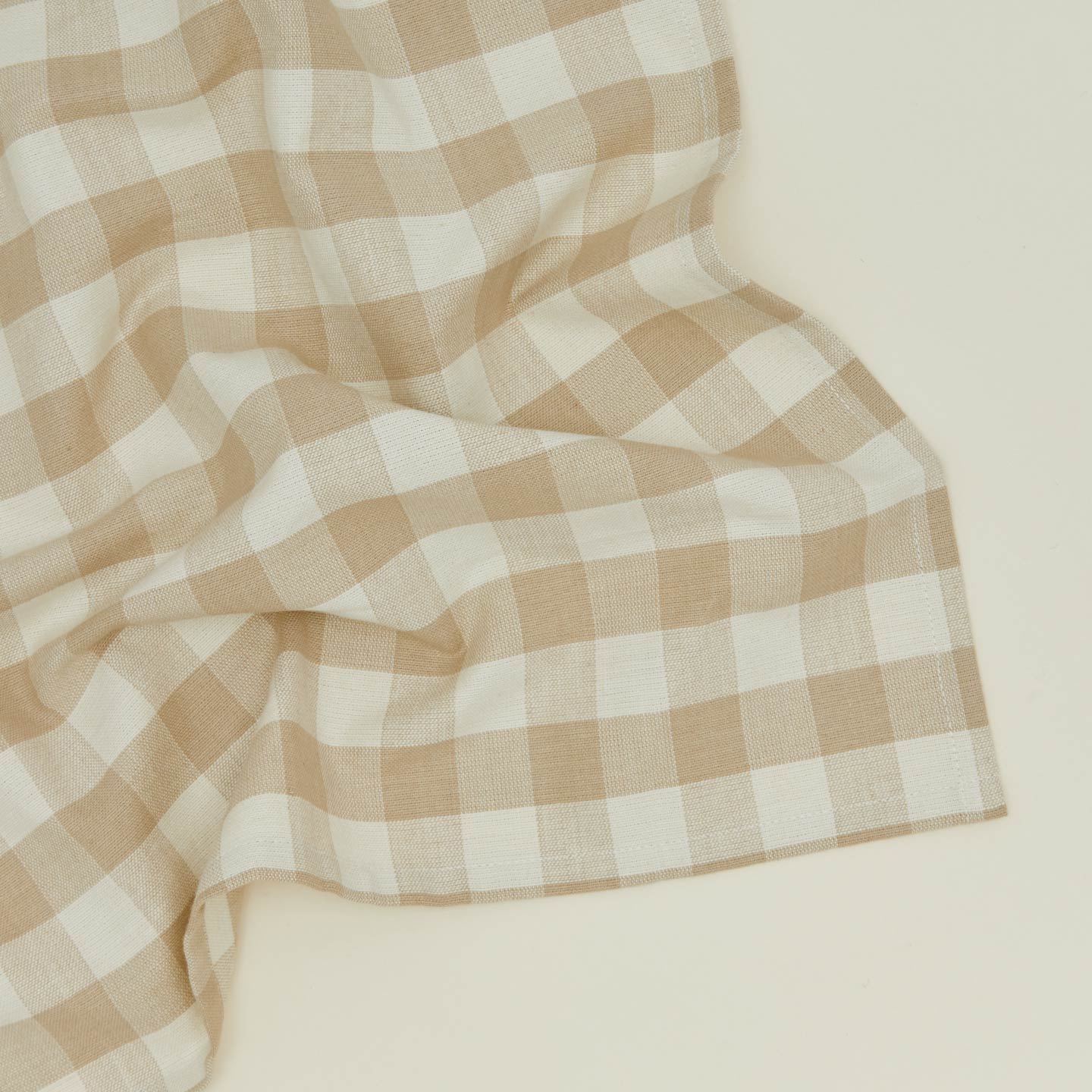 Close up view of Essential Gingham napkin in ivory/flax