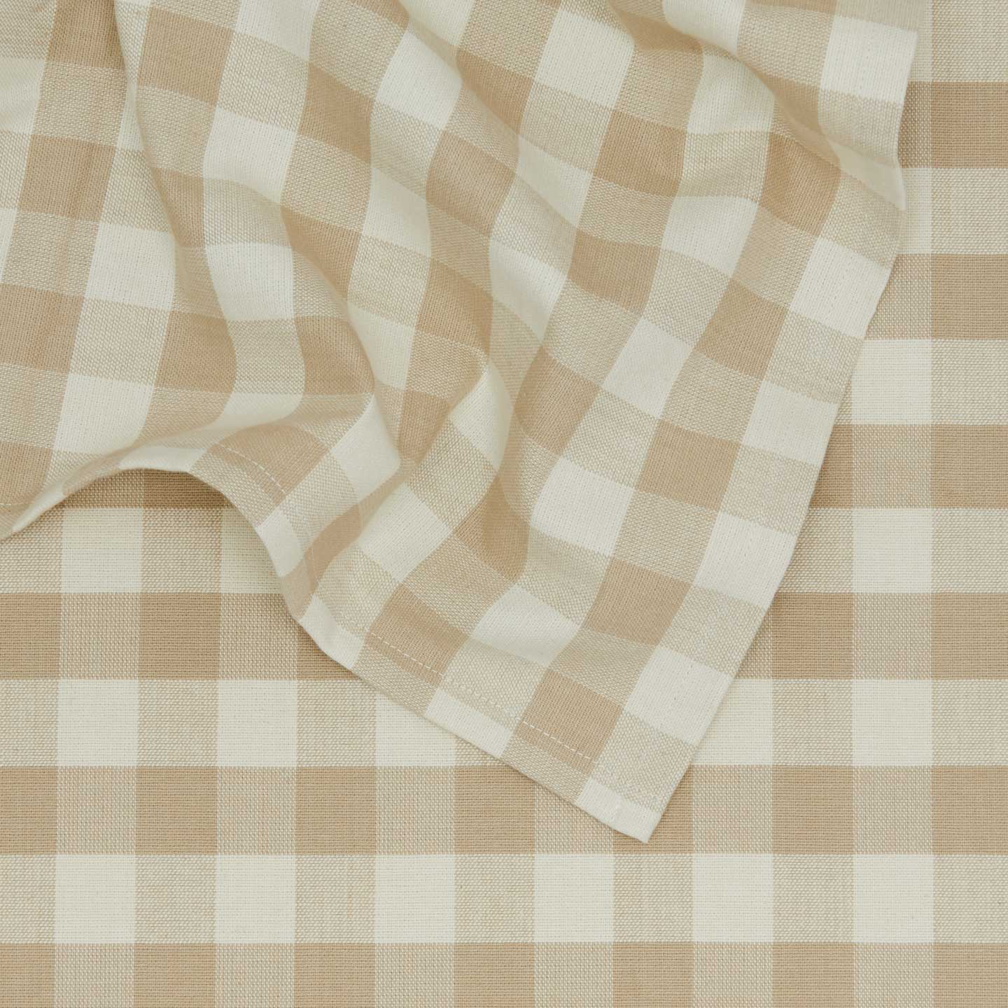 Close up view of Essential Gingham tablecloth in ivory/flax