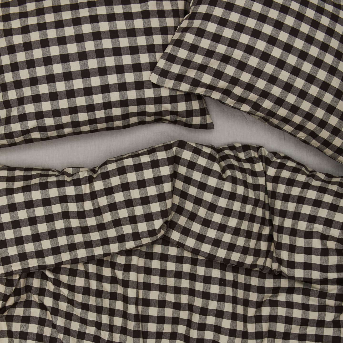 Essential Gingham Pillowcases, Set of 2 - Light Grey/Black on bed with matching duvet