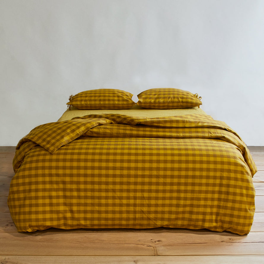 Essential Gingham Duvet - Mustard/Bronze on bed with matching pillow cases